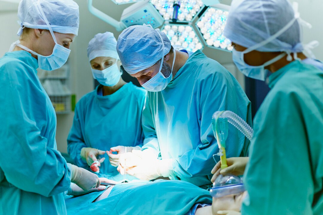 Surgeons performing operation in hospital